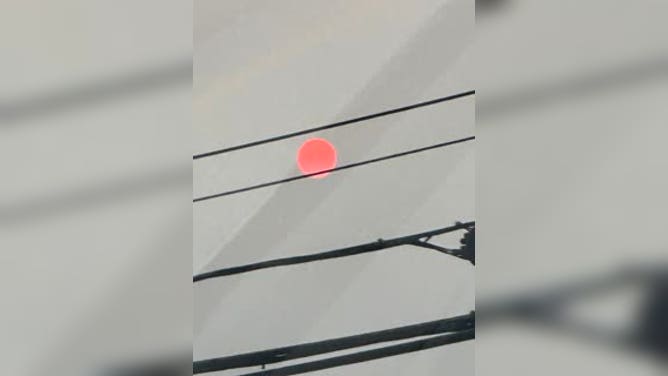 Hazy orange sun in Massachusetts Tuesday night