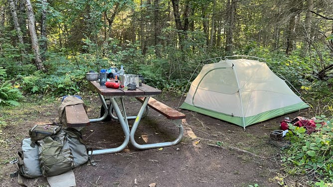 An unattended tent site in non-compliance with food storage regulations