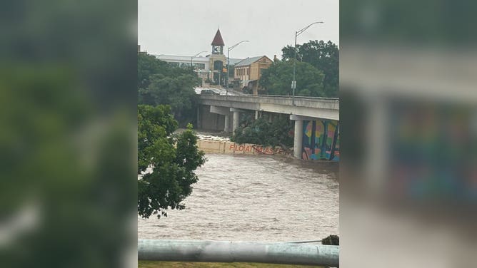 Photo of barge hitting the Sidney Baker Bridge in Kerrville, Texas. 