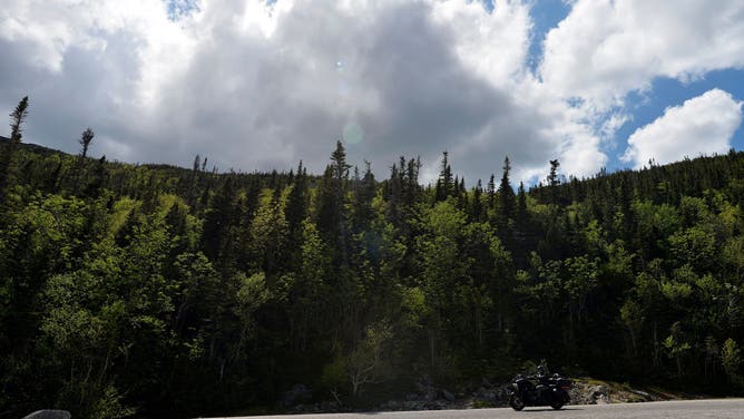 A motorcycle traverses the auto road that leads to the top of Mount Washington, standing at an elevation of 6,288.2 ft in the Presidential Range of the White Mountains in New Hampshire on June 12, 2020.
