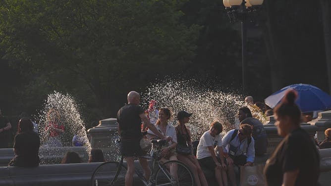 NEW YORK, UNITED STATES - JUNE 29: People spend time at Washington Square Park during hot weather in New York City, United States, on June 29, 2026.