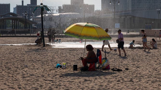 NEW YORK CITY - JUNE 29: People cool off at Coney Island beach on June 29, 2026 in the Brooklyn borough of New York City. A heat wave is forecast for much of the East Coast this week, with temperatures in the city expected to reach near 100 degrees, prompting Mayor Zohran Mamdani to activate a heat emergency plan that includes hundreds of cooling centers and intensified outreach and support for the vulnerable.
