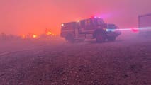 See it: Crews race to contain wildfires burning across Texas and Nevada amid dangerous fire weather