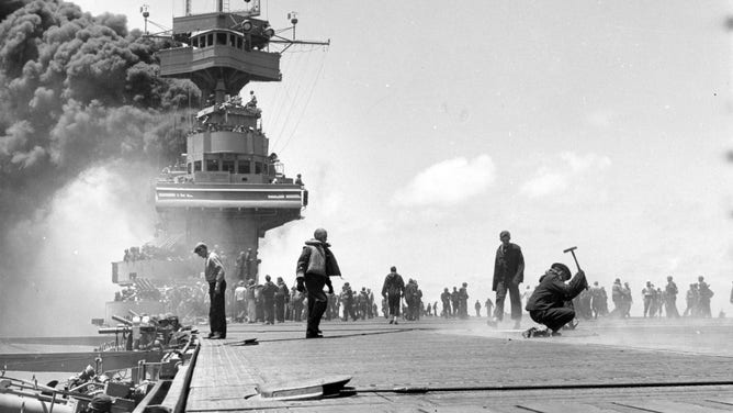 Scene on board USS Yorktown (CV-5), shortly after she was hit by three Japanese bombs on 4 June 1942.