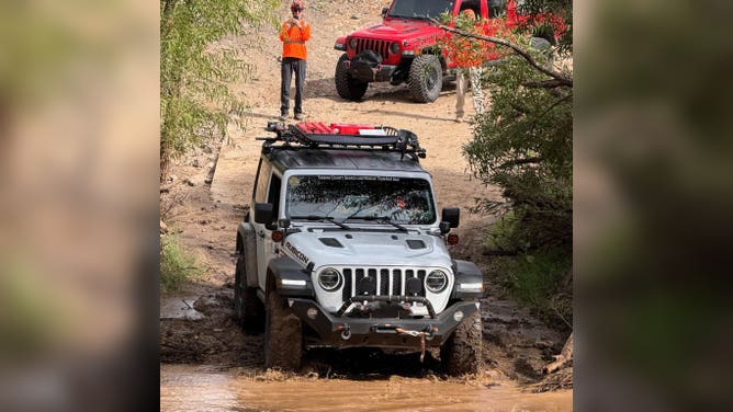 Stranded vehicle stuck in muddy conditions after recent monsoon weather.