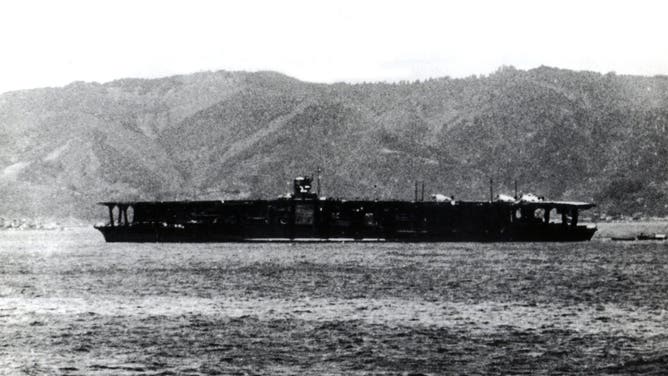 Japanese aircraft carrier "Akagi", in the Sukumo Bay (Japan), April 27, 1939. Begun as a battle cruiser of the Amagi class, its keel was built in the Kure shipyard where it was finished on March 25, 1927 as a carrier. Modernized and overhauled in 1938, the "Akagi" participated in the attacks on Pearl Harbor and Ceylan (against the British fleet). Bearing the insignia of Admiral Nagumo, it was sunk during the Battle of Midway, June 5, 1942, along with the Japanese carriers "Kaga", "Soryu" and "Hiryu".