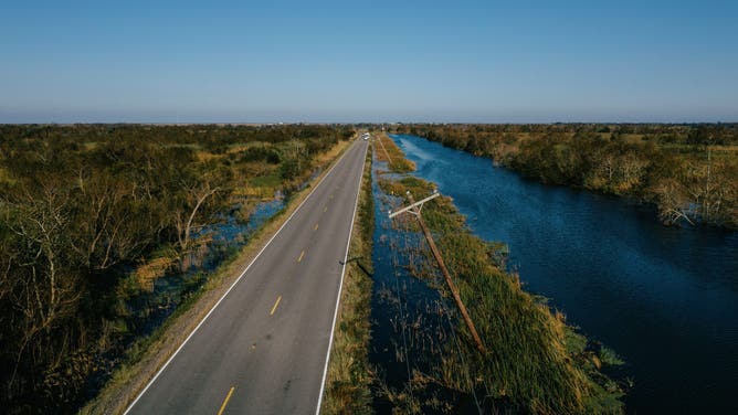 A bent Utility pole after Hurricane Delta made landfall in Pecan Island, Louisiana, U.S., on Saturday, Oct. 10, 2020.