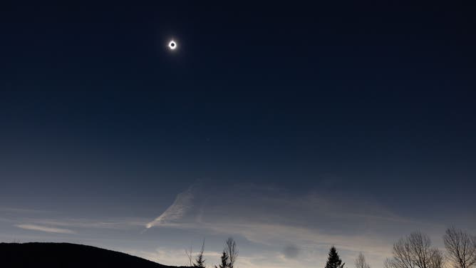 COLEBROOK, NEW HAMPSHIRE - APRIL 8: Darkness during totality of the Great North American Eclipse on April 8, 2024 in Colebrook, New Hampshire. Millions of people have flocked to areas across North America that are in the "path of totality" in order to experience a total solar eclipse. During the event, the moon will pass in between the sun and the Earth, appearing to block the sun.