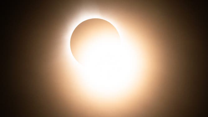 LAKE CARMI, VERMONT - APRIL 08: The "diamond ring" effect is seen during a total solar eclipse on April 08, 2024 in Lake Carmi, Vermont. Millions of people have flocked to areas across North America that are in the "path of totality" in order to experience a total solar eclipse. During the event, the moon will pass in between the sun and the Earth, appearing to block the sun.