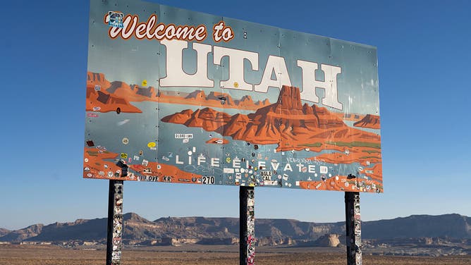 A sign reads "welcome to Utah" near Glen Canyon National Recreation Area on July 10, 2025 in Page, Arizona.
