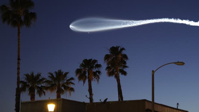 PASADENA, CALIFORNIA - APRIL 06: A SpaceX Falcon 9 rocket rises after launching from Vandenberg Space Force Base carrying 25 Starlink internet satellites on April 6, 2026 as seen from Pasadena, California.