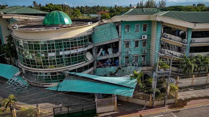 GENERAL SANTOS, PHILIPPINES - JUNE 09: An aerial view shows a collapsed building of the Notre Dame of Dadiangas University following a magnitude 7.8 earthquake on June 09, 2026 in General Santos, Sarangani province, Philippines.