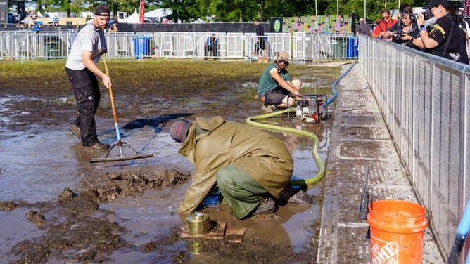MANCHESTER, TENNESSEE - JUNE 14: Festival crew work on the drainage system post rain storm during 2026 Bonnaroo Music And Arts Festival on June 14, 2026 in Manchester, Tennessee.