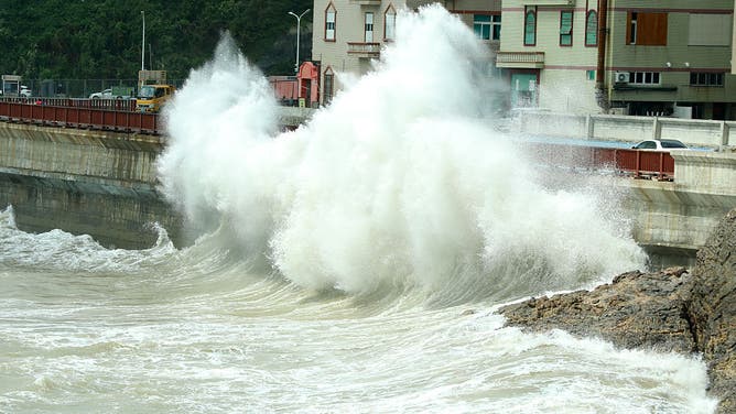 WENLING, CHINA - AUGUST 05: High waves pound the coast on August 5, 2026 in Wenling, Zhejiang Province of China.