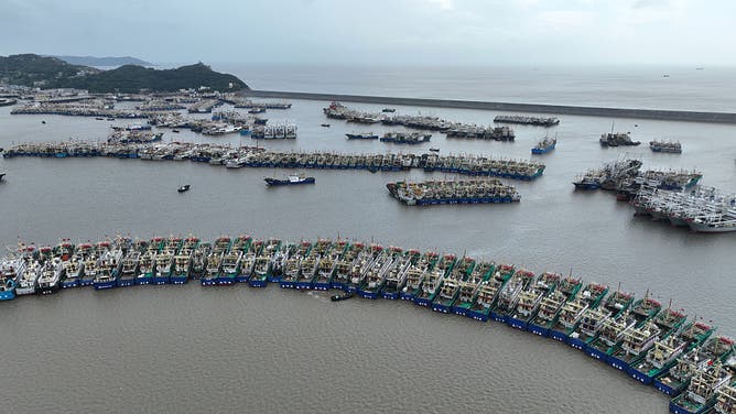 WENLING, CHINA - AUGUST 05: Fishing boats are docked at Ruoshan Fishing Port as Typhoon Dolphin, the 13th typhoon of the year, approaches on August 5, 2026 in Wenling, Zhejiang Province of China.