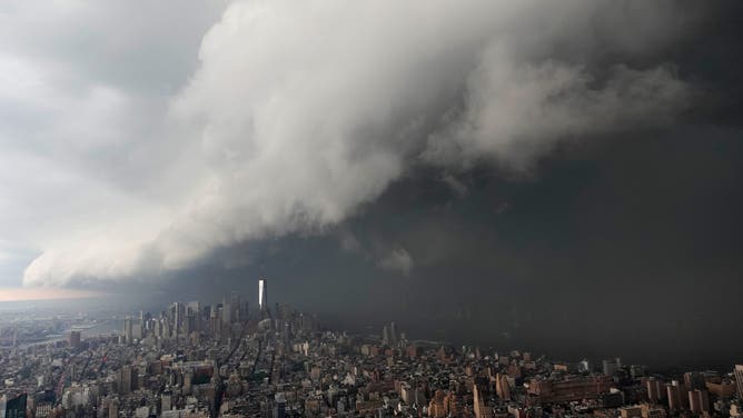 NEW YORK, NY - AUGUST 7: A thunderstorm crosses the Hudson River from Jersey City, New Jersey, into Lower Manhattan, seen from the 102nd-floor observation deck of the Empire State Building on August 07, 2026, in New York City.