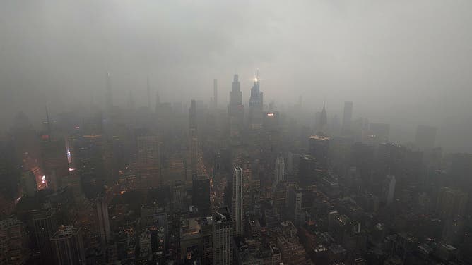 NEW YORK, NY - AUGUST 20: A thunderstorm passes through midtown Manhattan, seen from the 102nd-floor observation deck of the Empire State Building on August 20, 2026, in New York City.