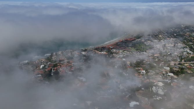 SAN DIEGO, CALIFORNIA - AUGUST 28: In an aerial view, fog envelopes the coastal community of La Jolla during a summer heat wave on August 28, 2026 in San Diego, California.