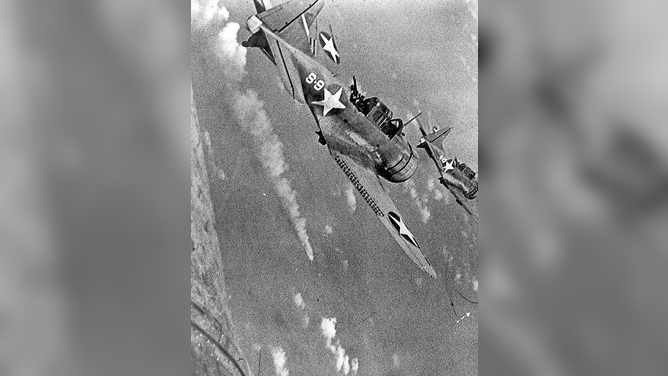 American dive-bombers attacking a Japanese ship during the Battle of Midway.