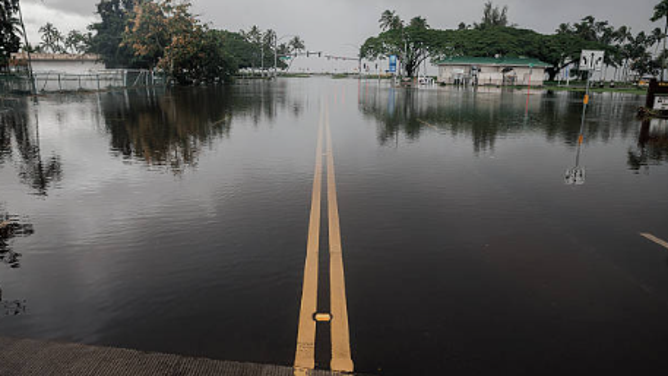 A flooded road is seen the day after Hurricane Lala in Hilo, Hawaii, Sunday, Aug. 16, 2026. The Category 1 hurricane brought heavy rain and strong winds to the island of Hawaii before moving away without making landfall.