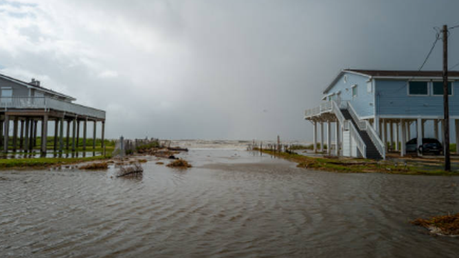 JAMAICA BEACH, TEXAS - JUNE 20: Seawater floods in through a neighborhood on June 20, 2024 in Jamaica Beach, Texas. Storm Alberto, the first named tropical storm of the hurricane season, was located approximately 305 miles south-southeast of Brownsville, Texas and formed yesterday in the Southwestern Gulf of Mexico. The storm has produced heavy winds and rainfall, creating flooding within various communities along Texas coastlines.