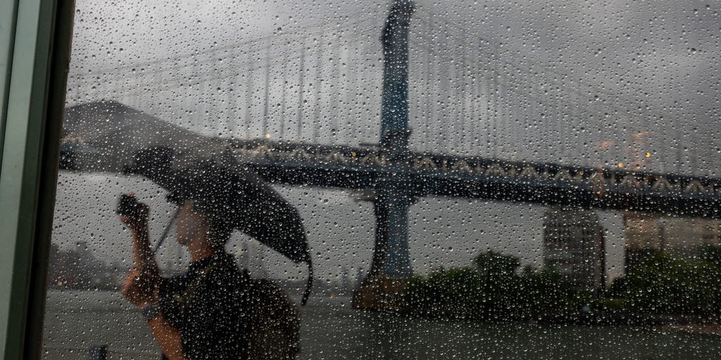 Flooding rain and thunderstorms drench major East Coast cities causing travel chaos