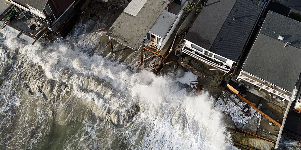 Powerful waves batter Southern California coast, damaging homes and triggering sinkhole