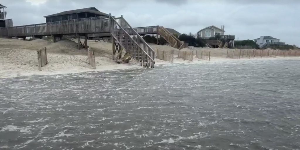 Intensifying nor'easter slams East Coast with violent surf and coastal flooding as worst still to come; waves up to 15 feet threaten Rodanthe homes