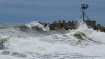 Strengthening nor’easter charges North, slamming the East Coast with coastal flooding, dangerous surf