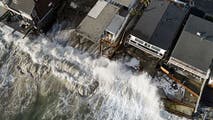 Powerful waves batter Southern California coast, damaging homes and triggering sinkhole