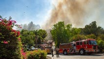 2 injured, evacuations underway as brush fire engulfs homes in Los Angeles County