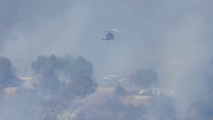 Evacuations underway as brush fire engulfs homes in Los Angeles County