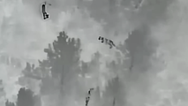 See it: Thermal drone captures unexpected visitors running through forest near Colorado school
