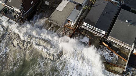 Powerful waves batter Southern California coast, damaging homes and triggering sinkhole