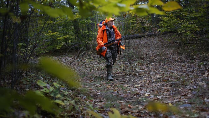 ACTON, ME - OCTOBER 27: Christine Barnes hunts for deer with her 7-month-old son Connor on Saturday, Oct. 27, 2018 in Acton. Barnes, who shot and killed a 130-pound doe on opening day last year, while hunting 5-months pregnant with Connor, wants him to have the same opportunities to experience hunting and other outdoors activities.