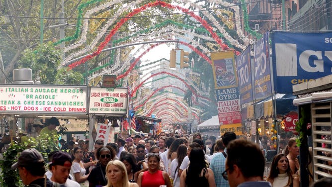 NEW YORK, NY - SEPTEMBER 17: People attend the Feast of Gennaro festival on Mullberry Street in Little Italy on September 17, 2023, in New York City.