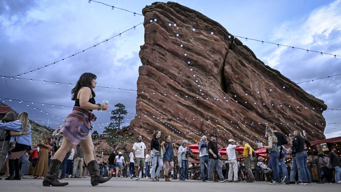 MORRISON , CO - JUNE 10: People walk the upper concourse before a Sheryl Crow concert at Red Rocks Amphitheater in Morrison, Colorado on Tuesday, June 10, 2025.