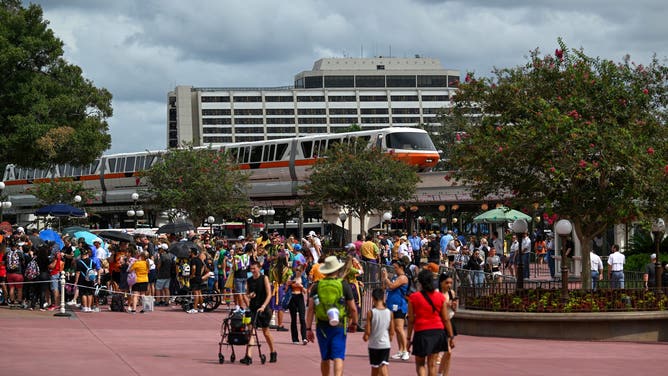 BAY LAKE, FL- SEPTEMBER 26: People visit Walt Disney World at Magic Kingdom as the monorail pulls into the station on Wednesday, September 26, 2023 in Bay Lake, Florida. Disney is suing Florida's Governor Ron DeSantis in federal court for violating the company's First Amendment rights.