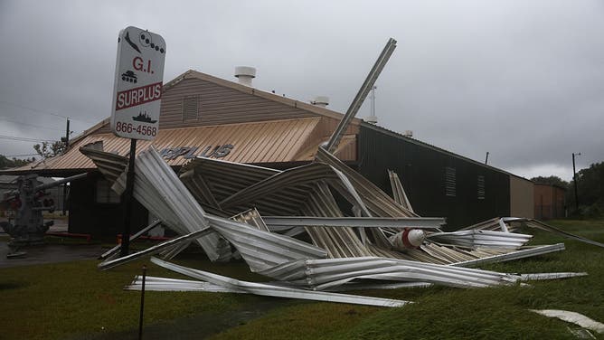 BEAUMONT, TEXAS - SEPTEMBER 1: A damaged G.I. Surplus store is seen during Tropical Storm Edouard on September 1, 2026 in Beaumont, Texas.