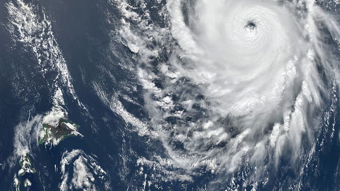 HAWAII, UNITED STATES - 2 SEPTEMBER 2026: Satellite view shows Hurricane Lowell churning in the Central Pacific south of Hawaii’s Big Island, with a distinct eye and major hurricane strength. The storm’s northward trajectory placed the northern island of Kauai at risk of destructive winds, flooding rains, and hazardous surf. Imaged 2 September 2026.