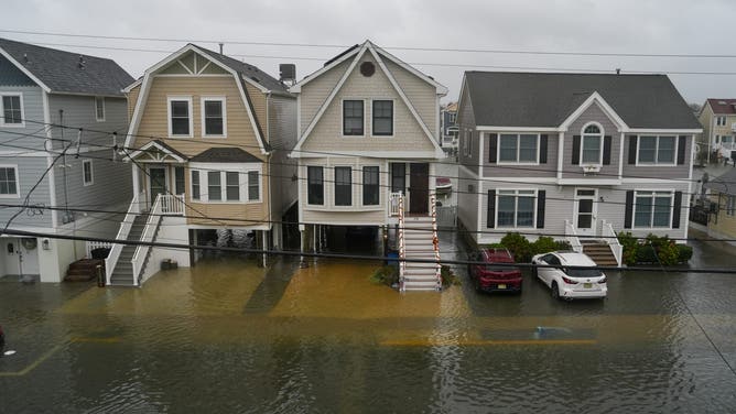 POINT PLEASANT, NEW JERSEY - SEPTEMBER 26: A flooded road is seen in front of homes during a nor'easter storm where a voluntary evacuation has been issued in the community on September 26, 2026 in Point Pleasant, New Jersey.