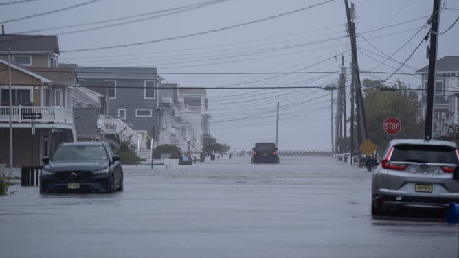 SURF CITY, NEW JERSEY, USA - SEPTEMBER 26: A view of a flooded street as a powerful nor'easter batters the Northeast coast with strong winds and coastal flooding in Surf City, New Jersey, USA, on September 26, 2026. Streets are inundated by seawater as large waves and storm surge push water into low-lying areas.