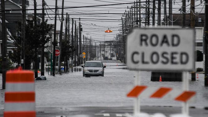 A van is seen stuck half-submerged in flood waters during the second day of a rare September nor'easter storm in Sea Isle City, New Jersey, on September 27, 2026.