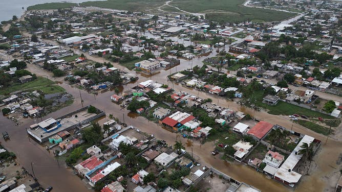 This aerial view shows flooded streets following the arrival of Hurricane Polo in the town of Puerto San Carlos, Baja California Sur, Mexico, on September 29, 2026. Hurricane Polo made landfall on Mexico's Baja California peninsula on September 29, cutting power and causing flooding as the sea breached coastal defenses.