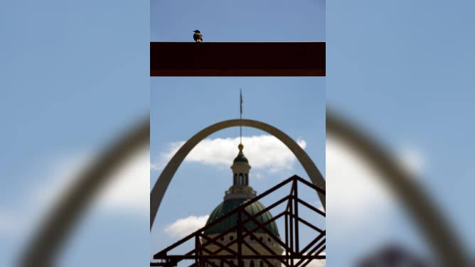 ST. LOUIS, MO - JULY 21: The St. Louis Gateway Arch rises above St. Louis on July 21, 2007 in St. Louis, Missouri. The Arch is 630 feet tall; 630 feet is also the distance from leg to leg at ground level. The Arch also known as the "Gateway to the West" was designed by Finnish-American architect Eero Saarinen. It stands 630 feet tall, and is 630 feet at its widest point. Saarinen also designed Dulles Airport outside of Washington, DC.