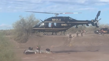 Responders rescue driver stranded on top of submerged car as strong floodwaters flow through Arizona