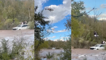 Helicopter rescues four people stranded atop vehicle in raging Arizona creek as severe storms slam Southwest
