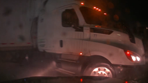 Watch: Nebraska driver narrowly avoids jackknifing semi-truck as pouring rain fuels flood threat in the Plains