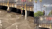 Watch: 3 rescued from rushing floodwaters as heavy rain swells Los Angeles wash