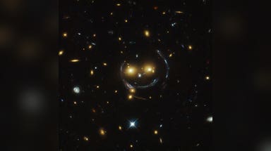 A giant smiley face in space? Hubble captures remarkable galaxy cluster